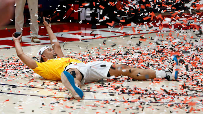 St. Bonaventure's Jaren Holmes soaks in the confetti after an A-10 championship win